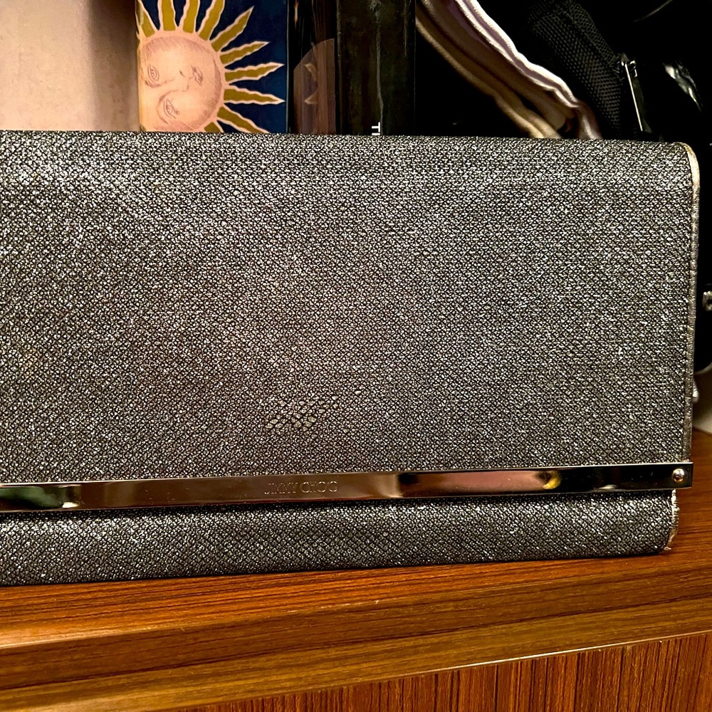 Jimmy Choo night out purse!holds more than it looks like.Efficient and cool.